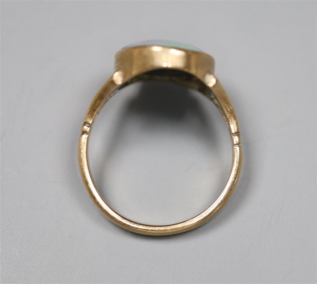 A 9ct and opal doublet set oval ring, size J, gross 2.7 grams.
